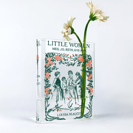 Little Women acrylic book vase with floral illustration and white daisies on a white background